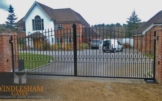 S-Top Metal Gates with Brick Piers and Access Control