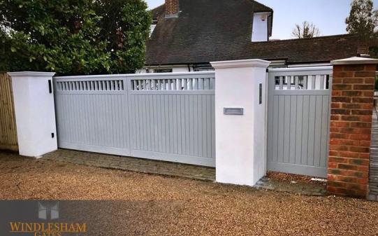Wooden Sliding Gate with Rendered Piers
