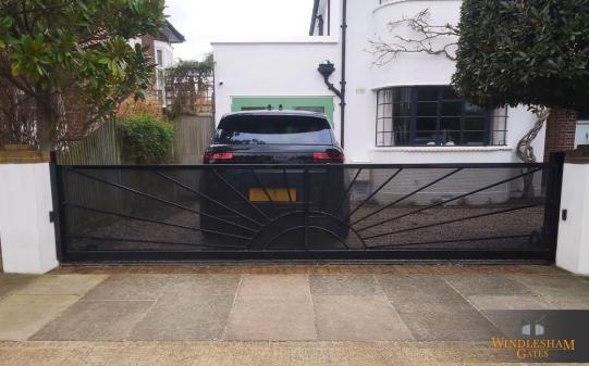 Sliding Gate with Sun Design