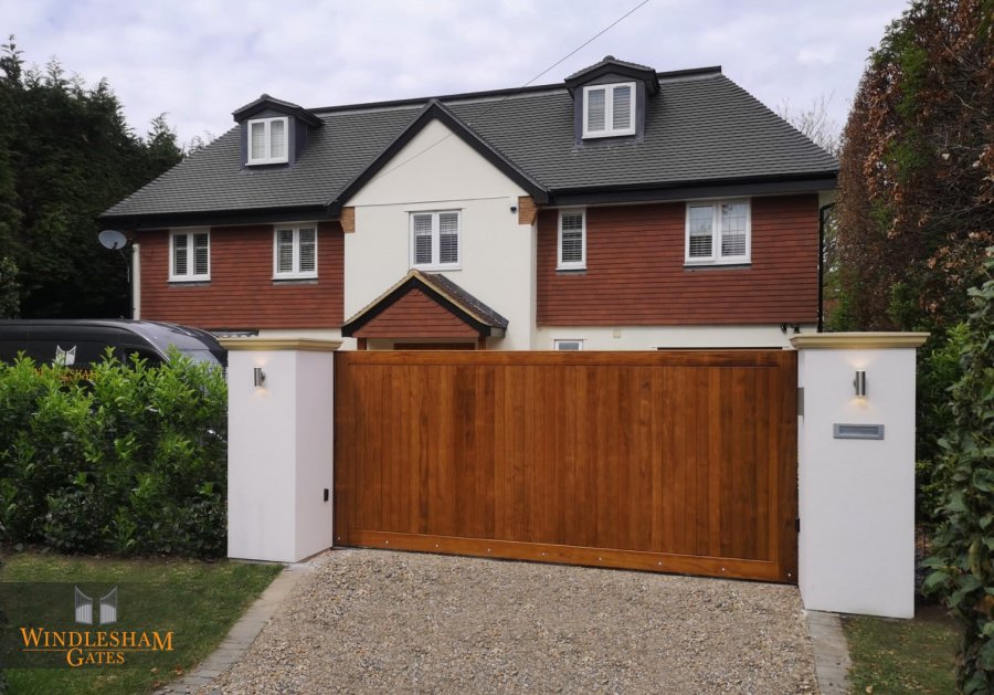 Wooden electric gate in front of a house